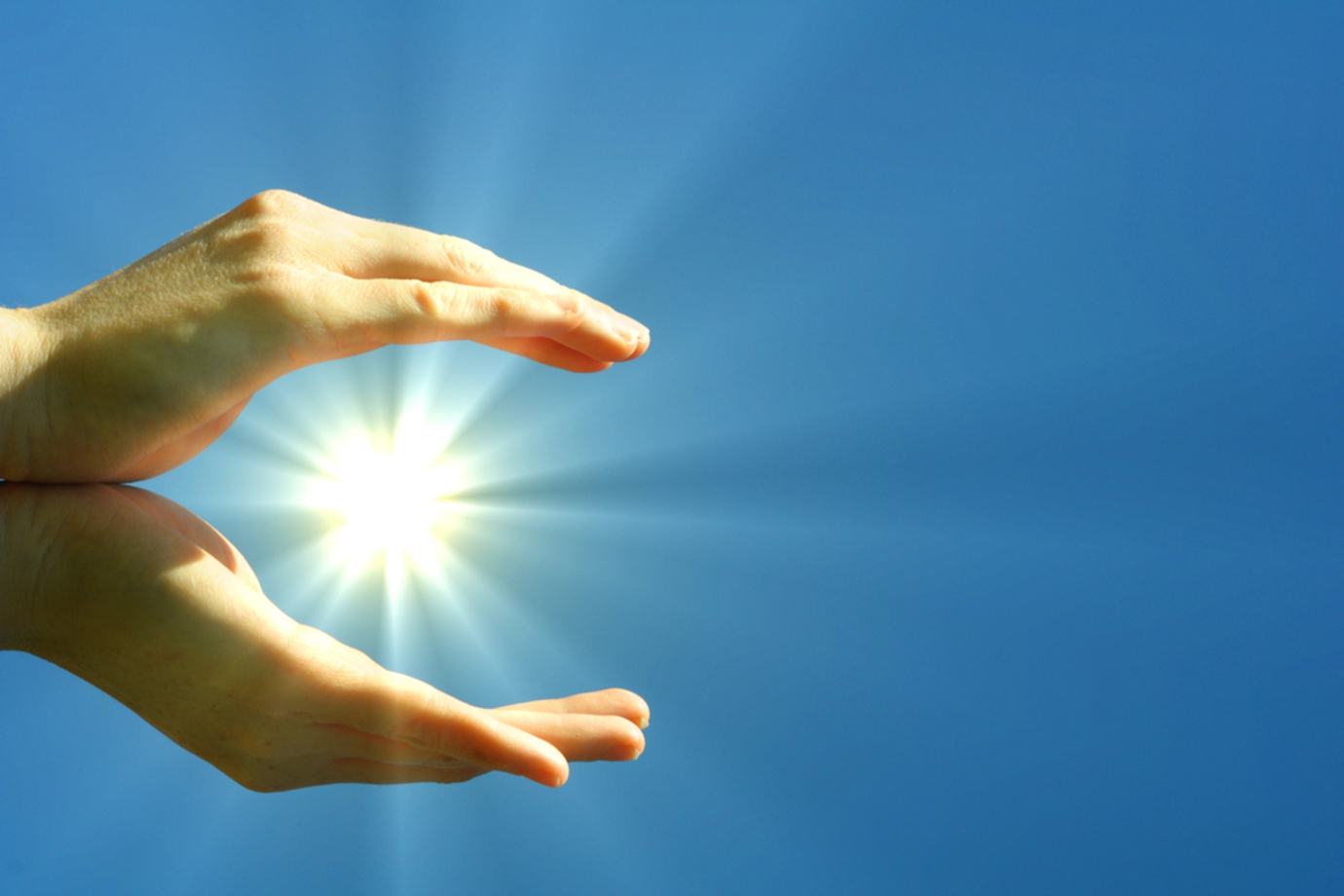 Hands open as though holding the sun against a blue sky. More than solar panel blog image for Southend on Sea area page. Installers of solar panels, EV chargers, air con, air source heat pumps and solar battery storage systems across Essex, London and Kent.