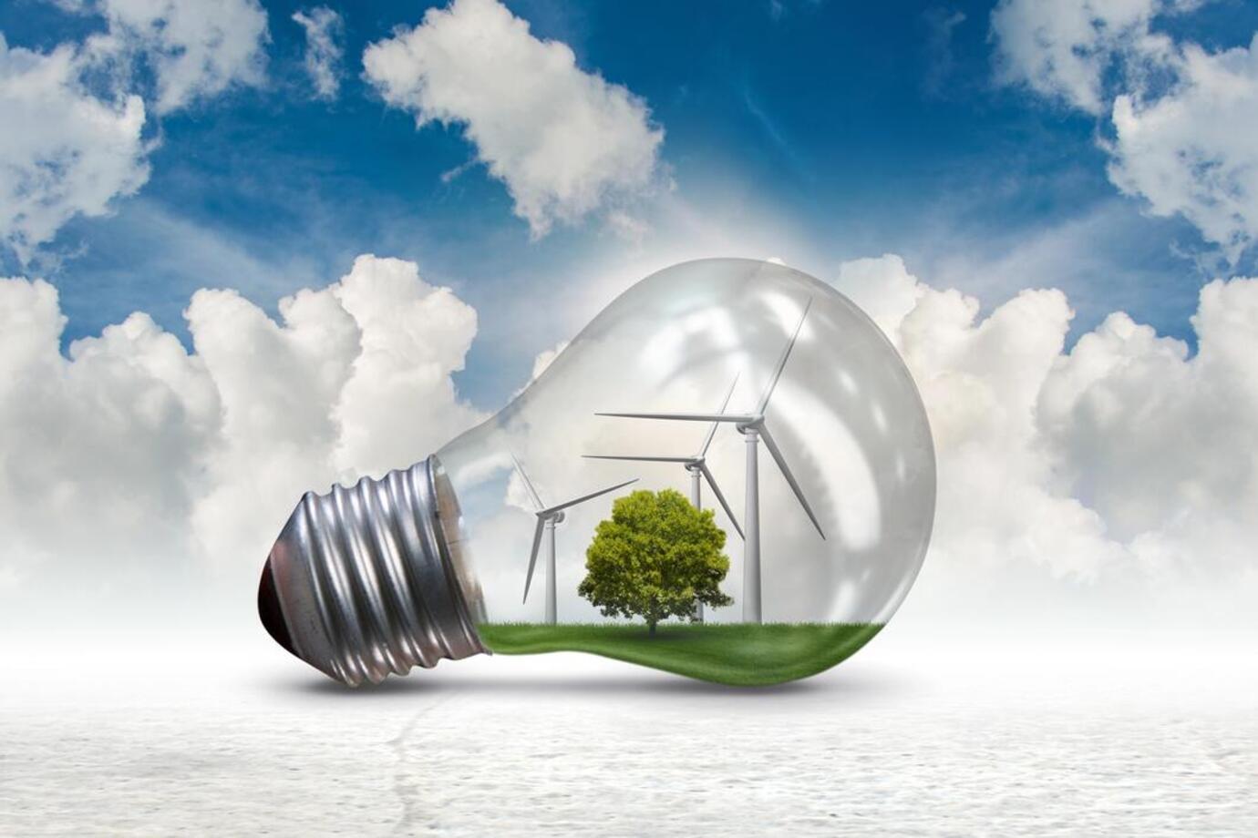 Large light bulb with wind turbines and a tree inside, cloud, sky backdrop. Wickford area page. Installers of solar panels, EV chargers, air con, air source heat pumps and solar battery storage systems across Essex, London and Kent.