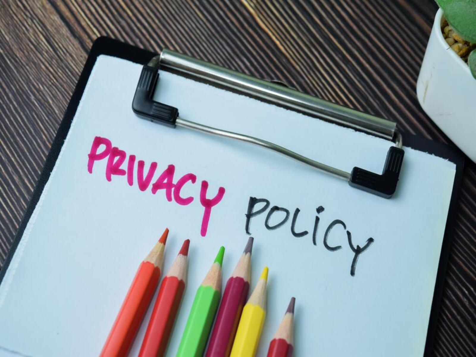 Privacy policy written on paper with row of coloured pencils underneath_image for privacy policy page_More than Solar Panels